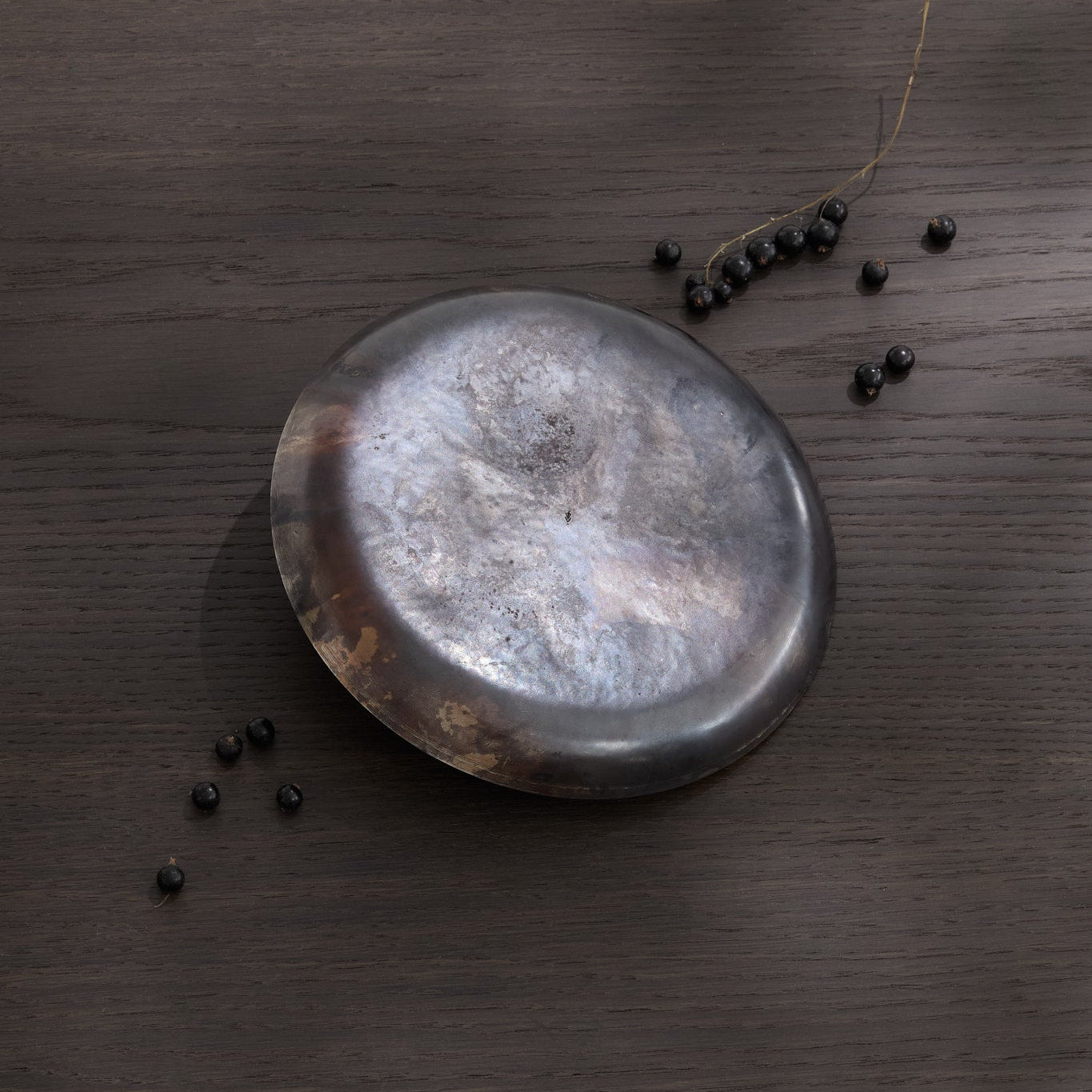 A picture of the back side of the tack hammer textured steel plate with black currants
