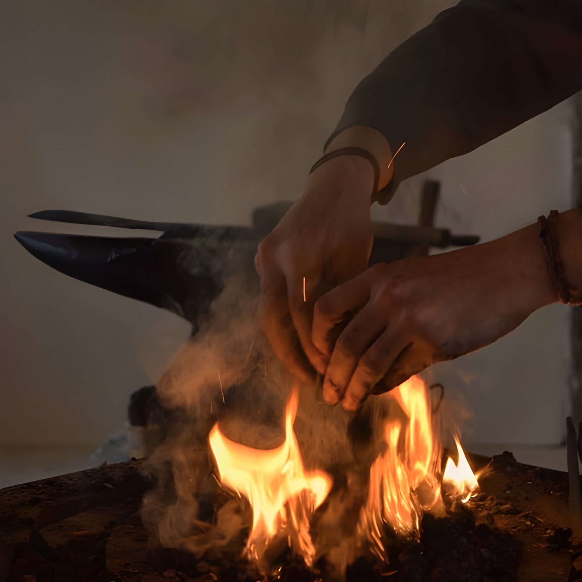Adding coal to the forge at Rocky Hill Forge in Copenhagen
