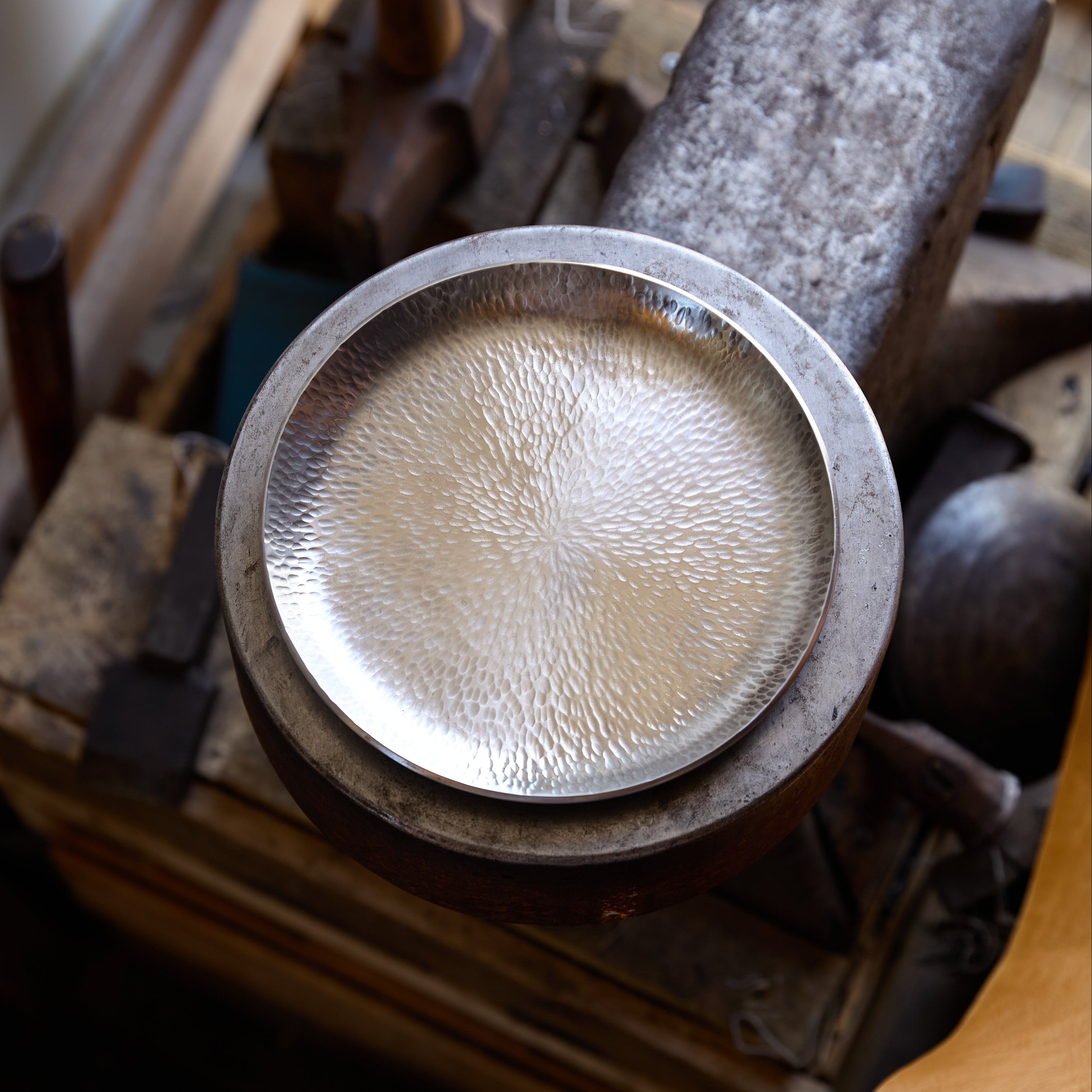 A tack hammer textured stainless steel plate